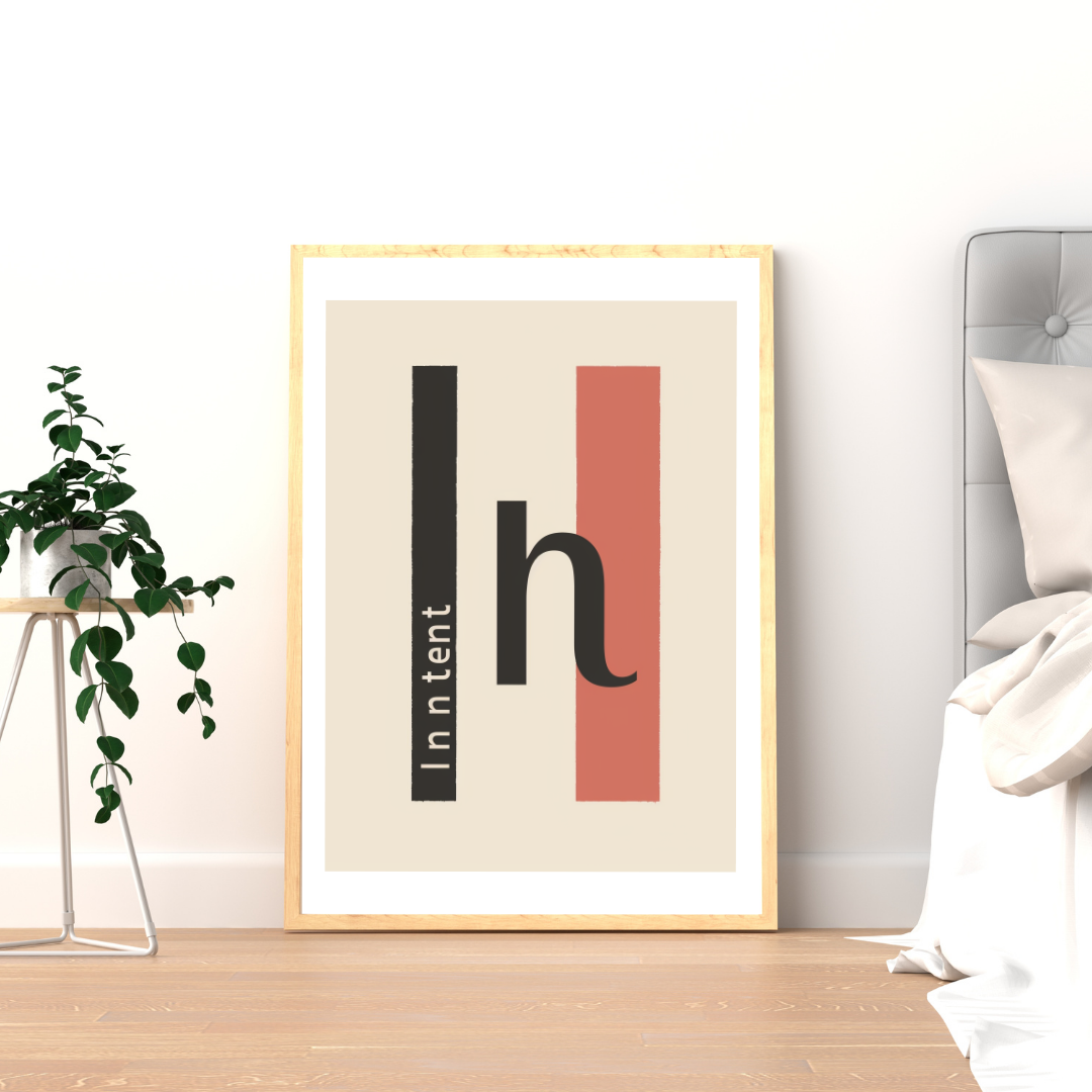 Beige minimalist väggposter med typografi från Nordanio, inramad och satt upp på vägg för modern inredningsstil.