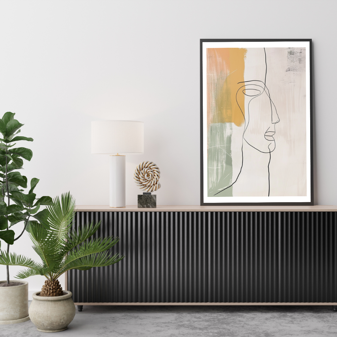 Abstrakt väggposter i grönt och rosa med minimalistisk kontinuerlig linjedesign från Nordanio, inramad på vägg.