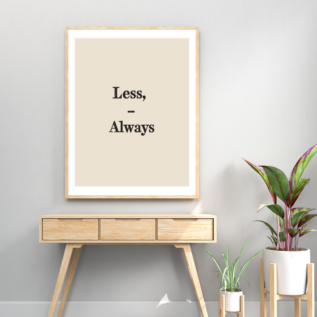 Typografiskt poster med orden "Less Always" i ljusgrått, inramad på en vägg, av Nordanio.