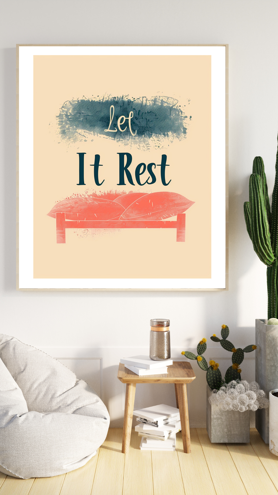 En minimalistisk typografisk poster med texten "Let It Rest" i modern stil, inramad på en neutral vägg.