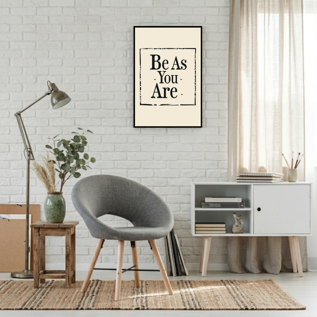 Typografi poster med texten "Be As You Are" av Nordanio, visad i minimalistisk inramning på vägg i modern hem.