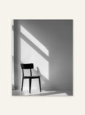 Svart och vitt poster av en svart stol från Nordanio, väggkonst med minimalistisk design och modern stil.