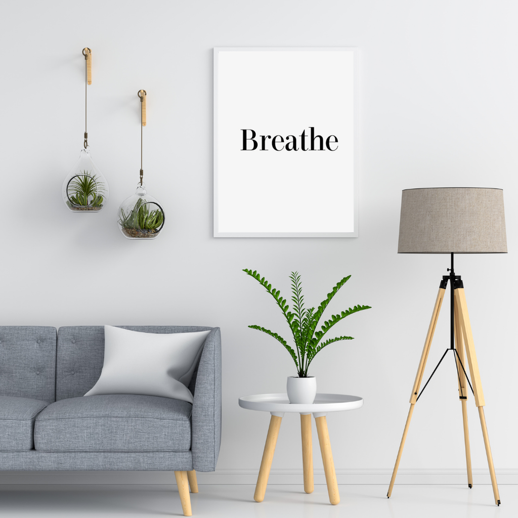Minimalist vitt typografiposter av Nordanio i modern inredningsstil, hängande på vit vägg i ett minimalistiskt rum.